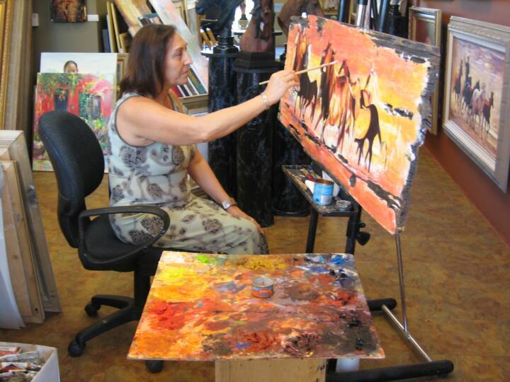 Ekaterina painting at the gallery